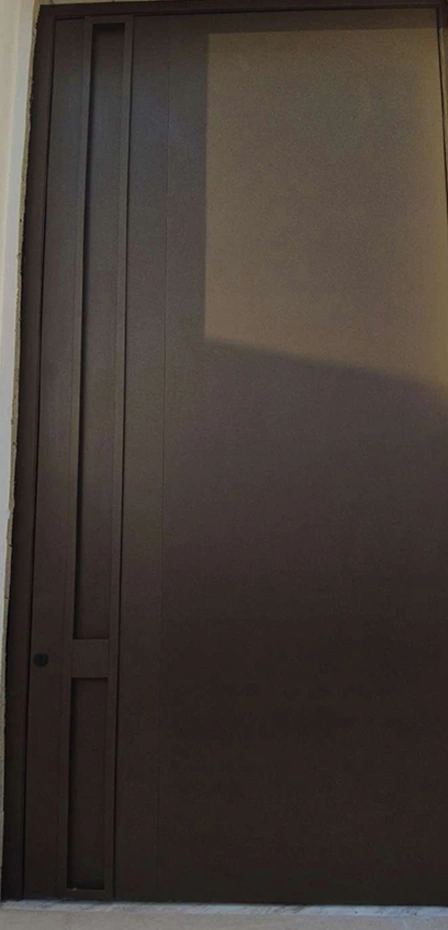 A brown entrance design with a broad plain panel and a recessed vertical edge detail.