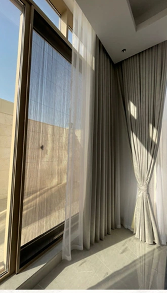 A screen arrangement for a large door opening.